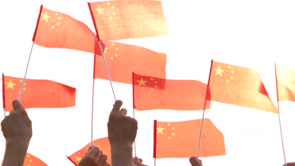 Close Up Hands Holding Flags of China