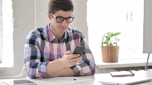 Young Man Using Smartphone