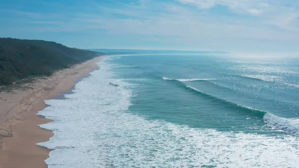 Flight Over the Sandy Beach and Waves