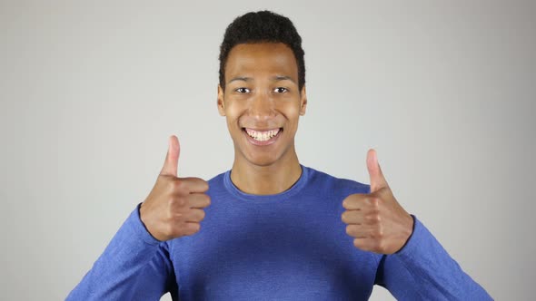 Thumbs Up with Both Hands By African Man White Background