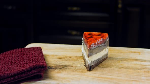 A Slice of Cake with Strawberries and Jelly