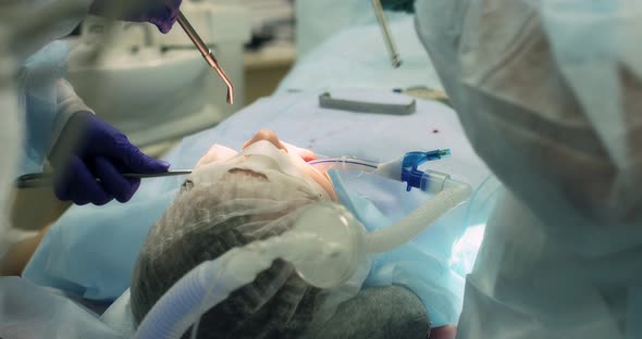 Surgical Operation to Remove a Tooth Under Anesthesia