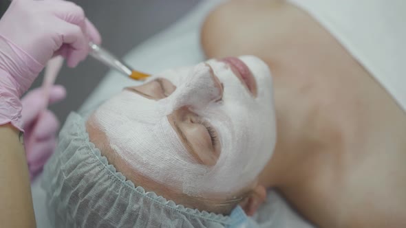 Applying Cosmetic Mask to the Patient's Face