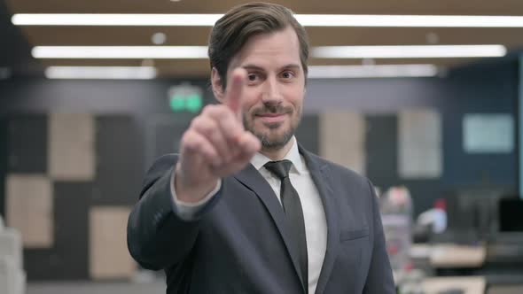 Portrait of Businessman Pointing at the Camera