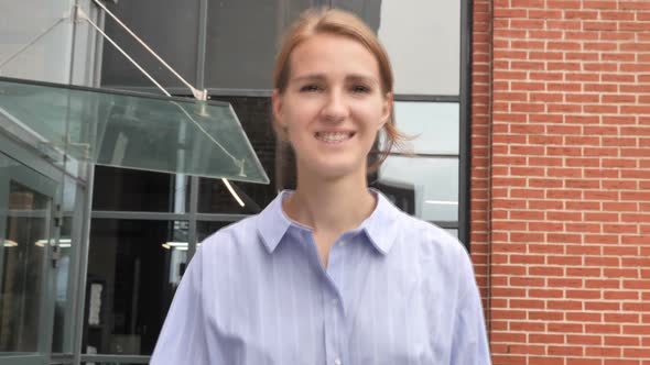 Young Casual Woman Walking on Street