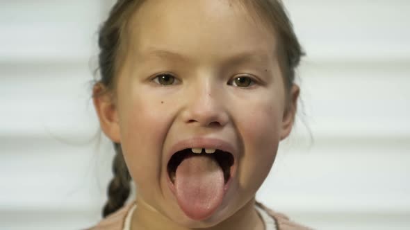 Girl of 78 Years Old Diligently Shows Her Tongue