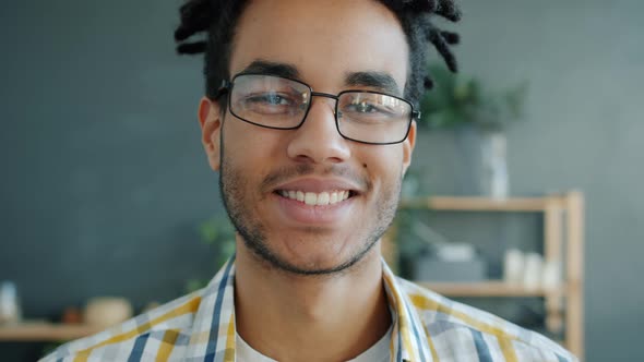 Close-up Portrait of Afro-American Guy Smiling and Looking at Camera