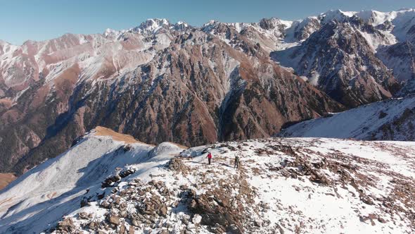 Aerial Shot of Small Hikers in the Beautiful Mountains