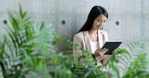 Business woman working on tablet computer 