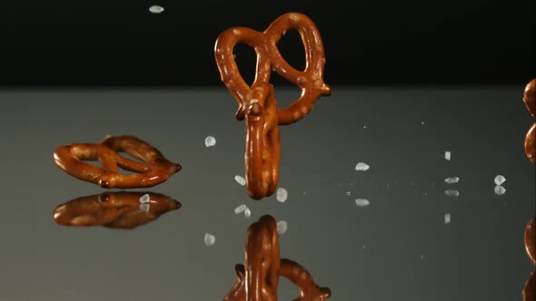 Pretzels falling and bouncing in ultra slow mo 1500fps - reflective surface - PRETZELS PHANTOM