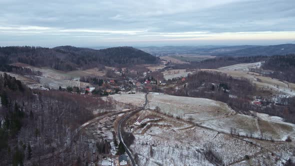 Winter Landscape with Village Near Mountains