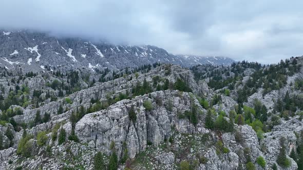 Heavy machinery drills tunnel through the mountain aerial view 4 K