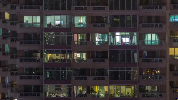 Flat Night Panorama of Multicolor Light in Windows of Multistory Buildings Aerial Timelapse