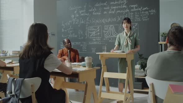 Asian Female Student Giving Speech during High School Class