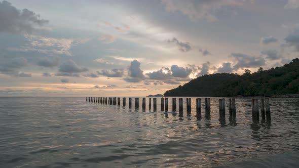 Timelapse view sunset at abandoned pier