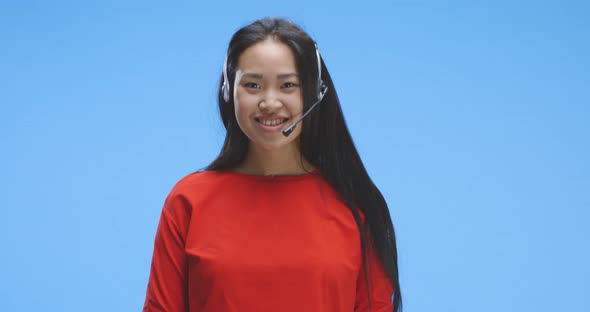 Young Woman Talking While Wearing Headset