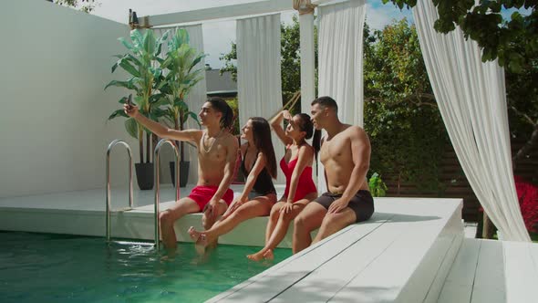 Happy Multiracial Friends Taking Selfie at Poolside