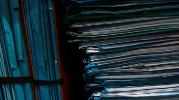 Stacks of Documents on a Shelf in the Archive