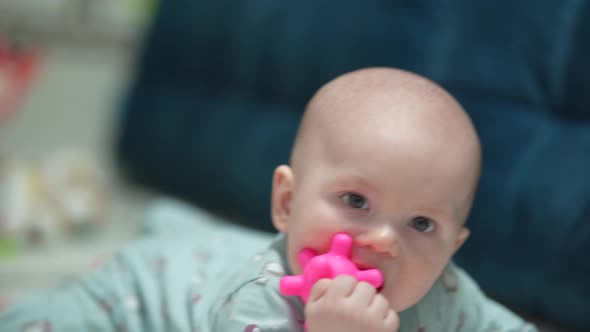 A Crawling Funny Baby Indoors at Home Play with Toys