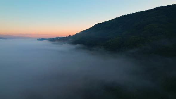 4K Drone Flying in the clouds. Flying through the clouds during sunrise