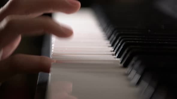 Young Girl Hand Playing Piano