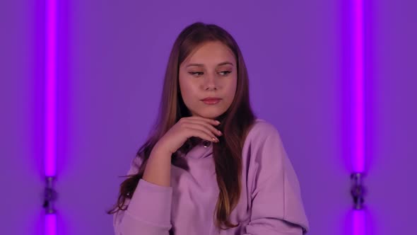 Portrait of Young Cute Woman Poses for Camera