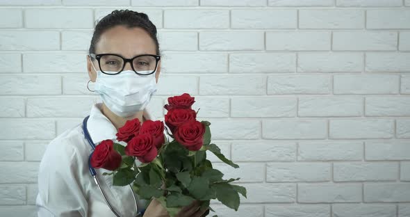 Doctor in mask with flowers.