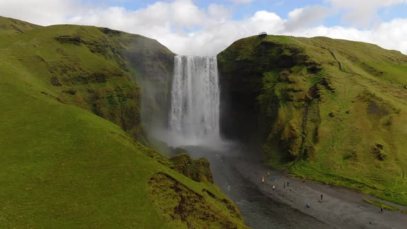 Drone approaching Skogafoss waterfall in Iceland, Europe