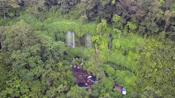 Family trip to the jungle, Primeval forest.Smooth aerial view flight hover drone footageWaterfall