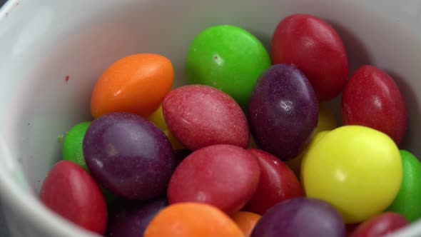 Colored Fruit Candies Rotate on a Black Background Colored Marco Sweets