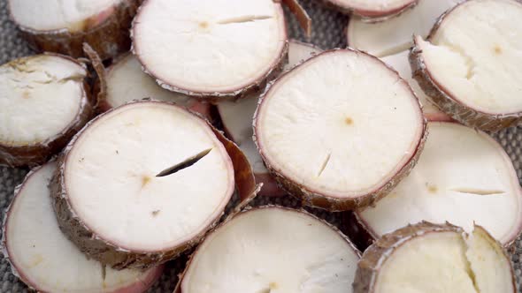 Sliced yucca root. Raw manioc slices. Dried cassava plant. Macro