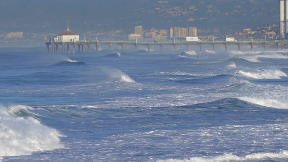 The Manhattan Beach Pier stands majestic over the Pacific Ocean.