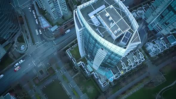 Drone flying over large modern condos in downtown Vancouver.