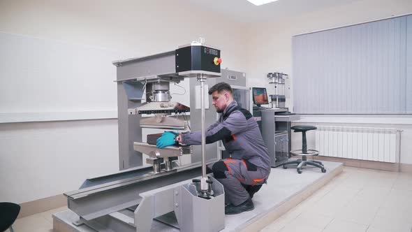 Man Works in the Laboratory of Building Materials