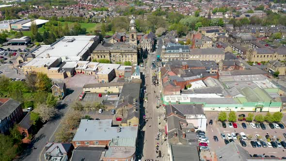 Aerial footage of the village of Morley in Leeds UK, showing an aerial view of the main street