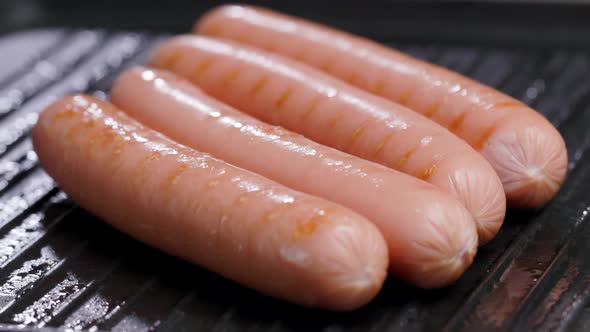 Meat Sausages Are Fried On Grill