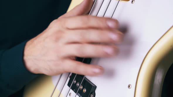 Bass Guitarist Sets Pace Beating Metal Strings on Guitar