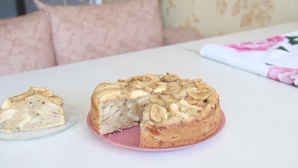 Baked And Sliced Apple Pie. Cooking Charlotte At Home. Shooting The Camera On The Slider.