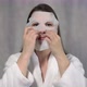 Young Woman Takes Care of Skin of Face - VideoHive Item for Sale