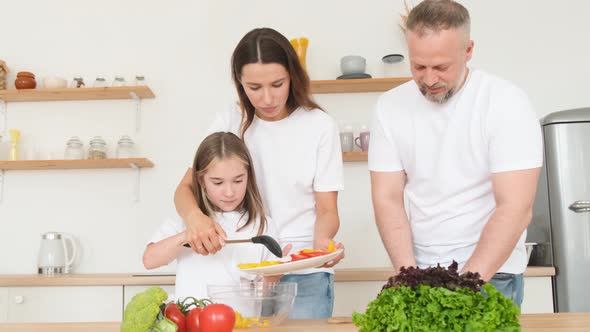 Family with Daughter Preparing Healthy Food