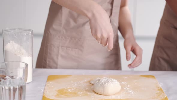 Portrait of Happy Young Asian Couple Cooking Together in the Kitchen at Home