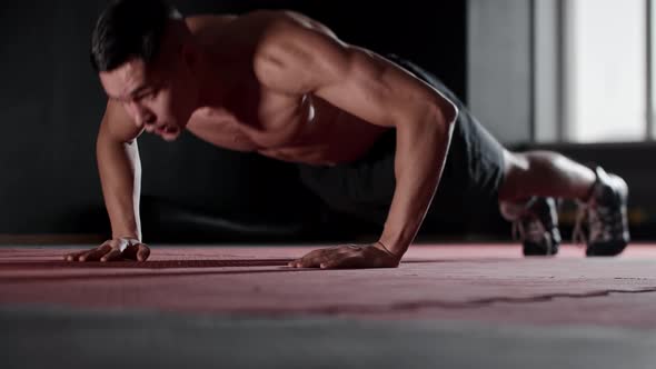 Fit Young Man Does Push Ups and Clapping His Hands