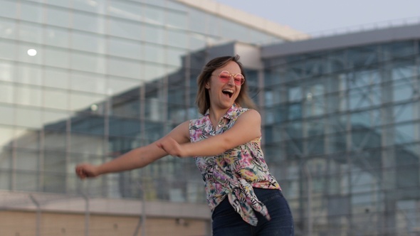 Happy Woman Tourist Dancing Floss Meme Dance Joyfully and Celebrating Success, Enjoying Music