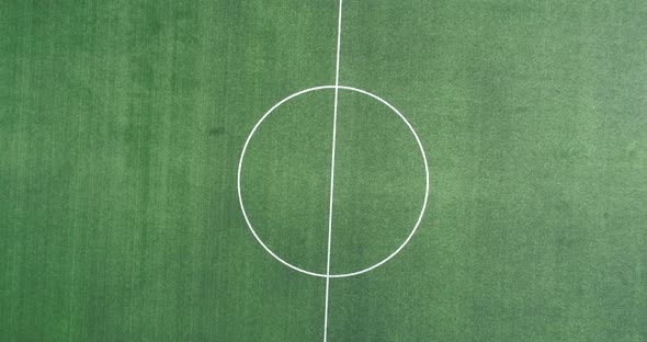 Aerial view of green football, soccer pitch. Top down view on a green, empty soccer field