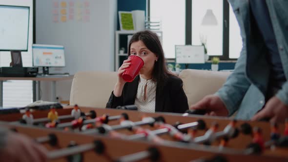Portrait of Businesswoman Drinking Beer From Cup After Work