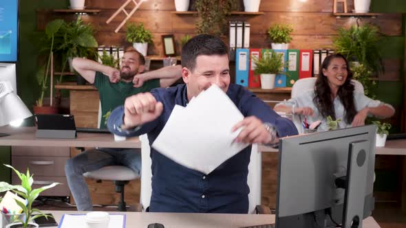 Office Workers Read an Exciting Email and Are Very Happy