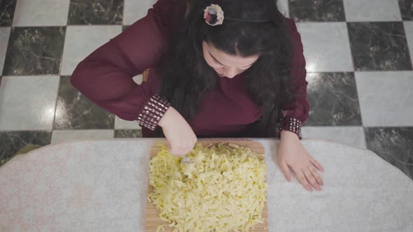 Top View of Confident Caucasian Fat Woman Greedily Eating Too Much Noodles Close-up. The Obese Lady