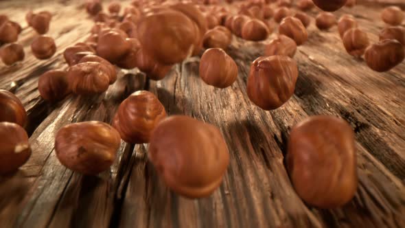 Super Slow Motion Detail Shot of Hazelnuts Rolling Towards at 1000Fps with Camera Motion