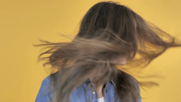 Pretty Woman Shaking Her Head Isolated on Yellow Background