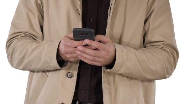 Man in Trench Coat Using Mobile Smart Phone on White Background